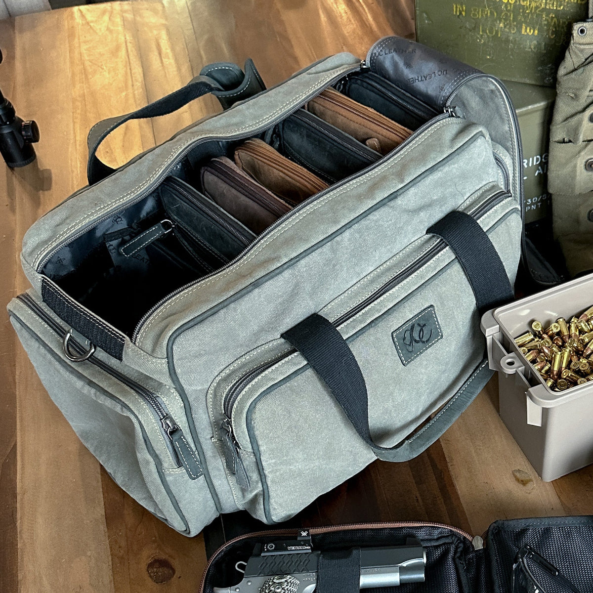 Grey range bag designed to fit UC Leather pistol cases ammo magazines and range gear